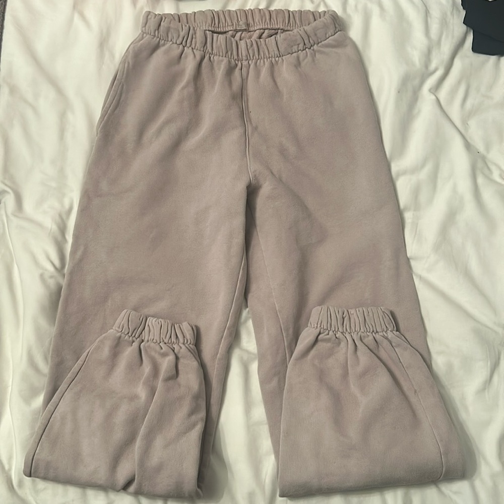 Pinkish, purpleish sweats cuffed at bottom